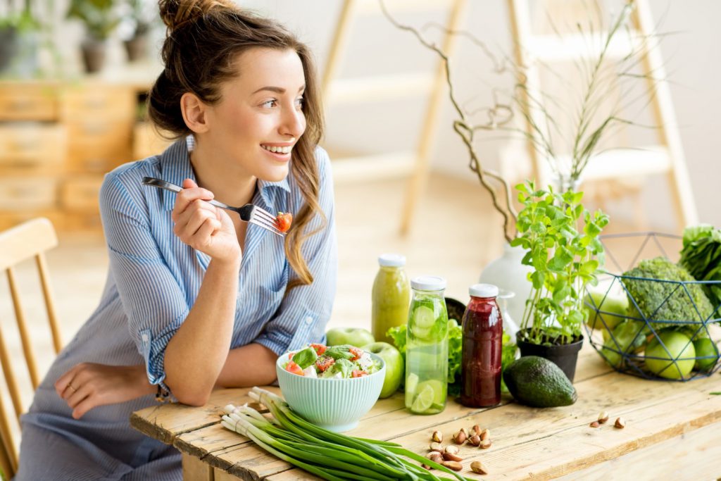 Woman eating salad