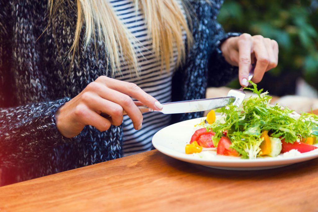 Person eating a salad