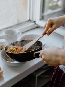 Person cooking on stove