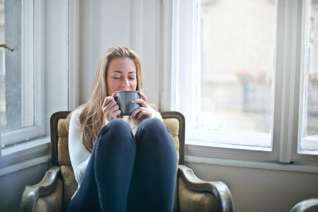 Woman holding mug of tea