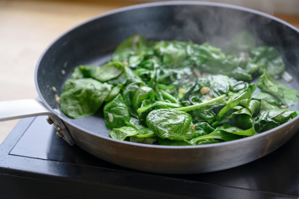 Spinach cooking in a pan